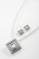 A rhombus shaped necklace and earrings set. A rhombus shaped necklace and earrings set.