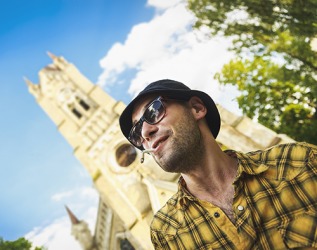 It might be considered sacrilege to wear a hat and sunglasses while smoking a cigarette when attending a church service. It might be considered sacrilege to wear a hat and sunglasses while smoking a cigarette when attending a church service.
