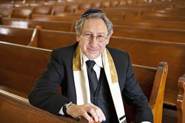A rabbi sitting in a schul (synagogue). A rabbi sitting in a schul (synagogue).