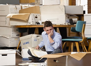 Larry screwed up filing taxes for his business so now he has to go through previous years' paperwork for the audit. Larry screwed up filing taxes for his business so now he has to go through previous years' paperwork for the audit.