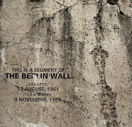 The Berlin Wall was erected by the communist East German government to enforce the segregation of its people from the democratic West. The Berlin Wall was erected by the communist East German government to enforce the segregation of its people from the democratic West.
