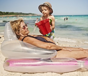 Owen was up to his usual shenanigans by surprising his grammie with a bucket of ocean water as she napped on the beach. Owen was up to his usual shenanigans by surprising his grammie with a bucket of ocean water as she napped on the beach.