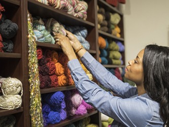 Jeannie selected a skein of yarn for her next knitting project. Jeannie selected a skein of yarn for her next knitting project.