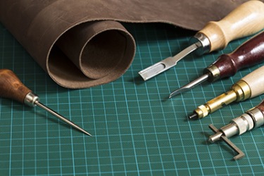 The tool in the top right corner is called a skiver and is used to skive leather. The tool in the top right corner is called a skiver and is used to skive leather.