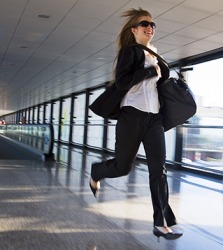 Joanie slung her bag over her shoulder as she raced through the airport to catch her flight. Joanie slung her bag over her shoulder as she raced through the airport to catch her flight.