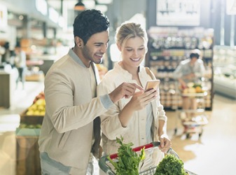 Greta uses her smart phone to make her grocery list, compare prices, and find recipes. Greta uses her smart phone to make her grocery list, compare prices, and find recipes.