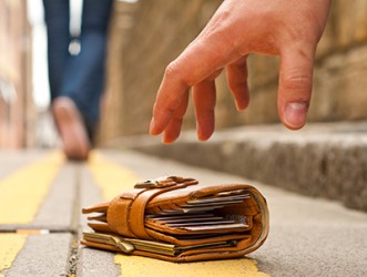 The man showed that he was a person of integrity when he picked up the wallet and returned it to the pedestrian who unknowingly dropped it. The man showed that he was a person of integrity when he picked up the wallet and returned it to the pedestrian who unknowingly dropped it.