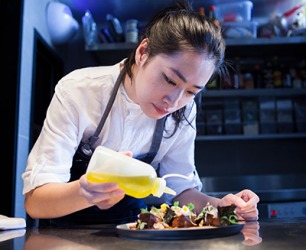The chef at the upscale restaurant needs to be meticulous while plating the dish. The chef at the upscale restaurant needs to be meticulous while plating the dish.