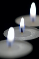 Three burning candles. Three burning candles.