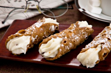 Three sweet Italian cannolis. Three sweet Italian cannolis.
