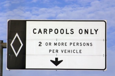 A sign designating the highway lane for carpools. A sign designating the highway lane for carpools.