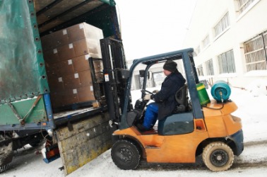 Cargo being loaded onto a truck. Cargo being loaded onto a truck.