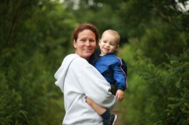 A mother carrying her child. A mother carrying her child.