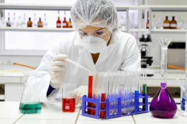 A chemist at work in her chemistry laboratory. A chemist at work in her chemistry laboratory.