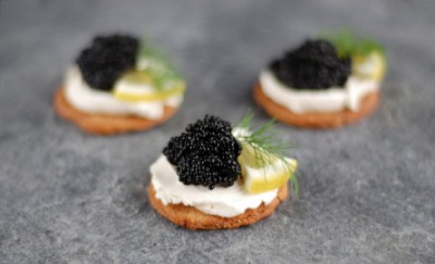 Toast and cream cheese topped with caviar. Toast and cream cheese topped with caviar.