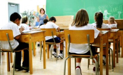 Students seated in a classroom. Students seated in a classroom.