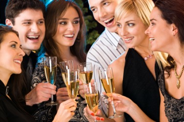 A group of people celebrating an occasion with glasses of champagne. A group of people celebrating an occasion with glasses of champagne.