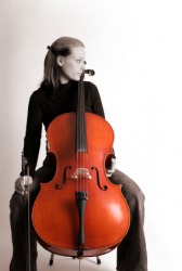 A cellist with her cello. A cellist with her cello.