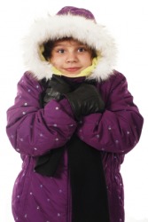 A little girl snuggling in her warm winter coat. A little girl snuggling in her warm winter coat.