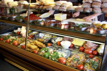 Food displayed in a delicatessen or deli. Food displayed in a delicatessen or deli.