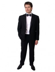 A young man in a dinner jacket. A young man in a dinner jacket.
