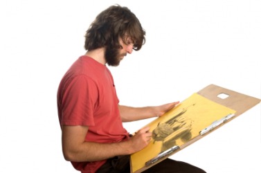 An artist using a drawing board. An artist using a drawing board.