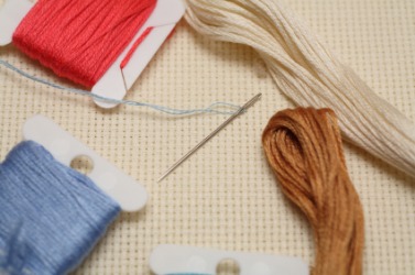 Materials used to embroider a peice of fabric. Materials used to embroider a peice of fabric.