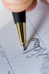 Endorsing a check. Endorsing a check.