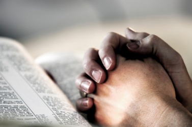 A person expresses their faith in God through prayer. A person expresses their faith in God through prayer.