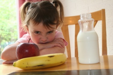 A finicky eater refusing healthy food. A finicky eater refusing healthy food.