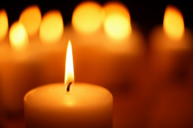 Flame on a golden candle. Flame on a golden candle.