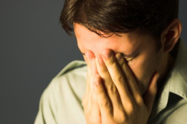 A man deals with grief. A man deals with grief.