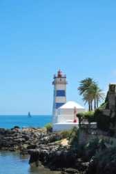 A lighthouse set against an azure sky. A lighthouse set against an azure sky.