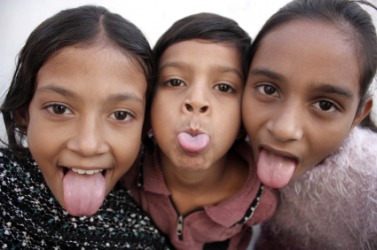 Three impish children. Three impish children.