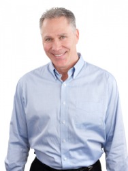 A man wearing a button-down shirt. A man wearing a button-down shirt.