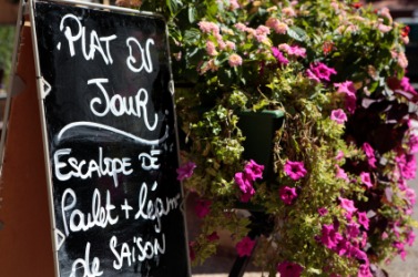 A restaurant menu written in French. A restaurant menu written in French.