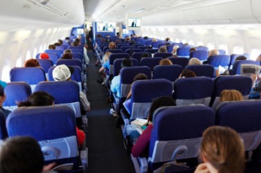Flying coach on an airplane. Flying coach on an airplane.