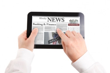 A man reads a news article. A man reads a news article.