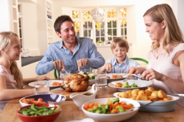 A family having dinner at the table. A family having dinner at the table.