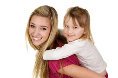 This young woman is employed to care for this child. This young woman is employed to care for this child.