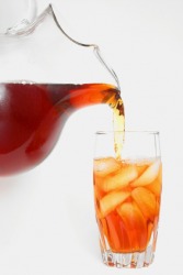 Tea being poured into a glass. Tea being poured into a glass.