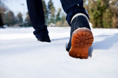 A person trudges through the snow. A person trudges through the snow.