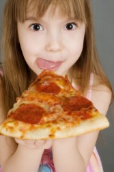 A little girl eats a big piece of pizza. A little girl eats a big piece of pizza.
