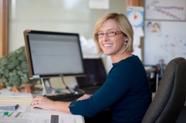 A woman working in an office. A woman working in an office.