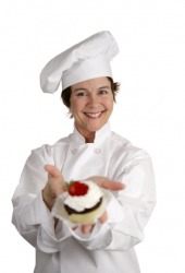 A patissier displays her work. A patissier displays her work.