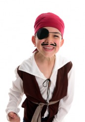 A little boy plays pirate wearing an eye patch. A little boy plays pirate wearing an eye patch.