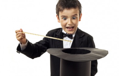 A young magician about to say ta-da! A young magician about to say ta-da!