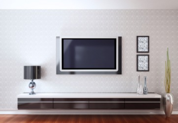 A television mounted on a wall. A television mounted on a wall.