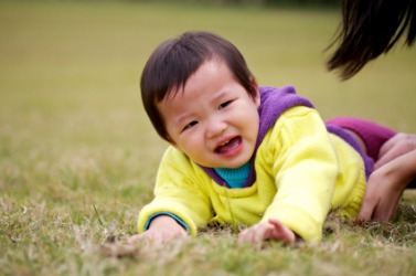 A child boohoos after a fall. A child boohoos after a fall.