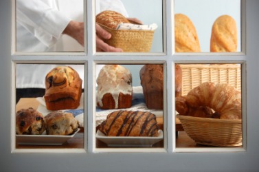 Baked goods in a boulangerie window. Baked goods in a boulangerie window.